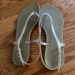 Tan jelly sandals.